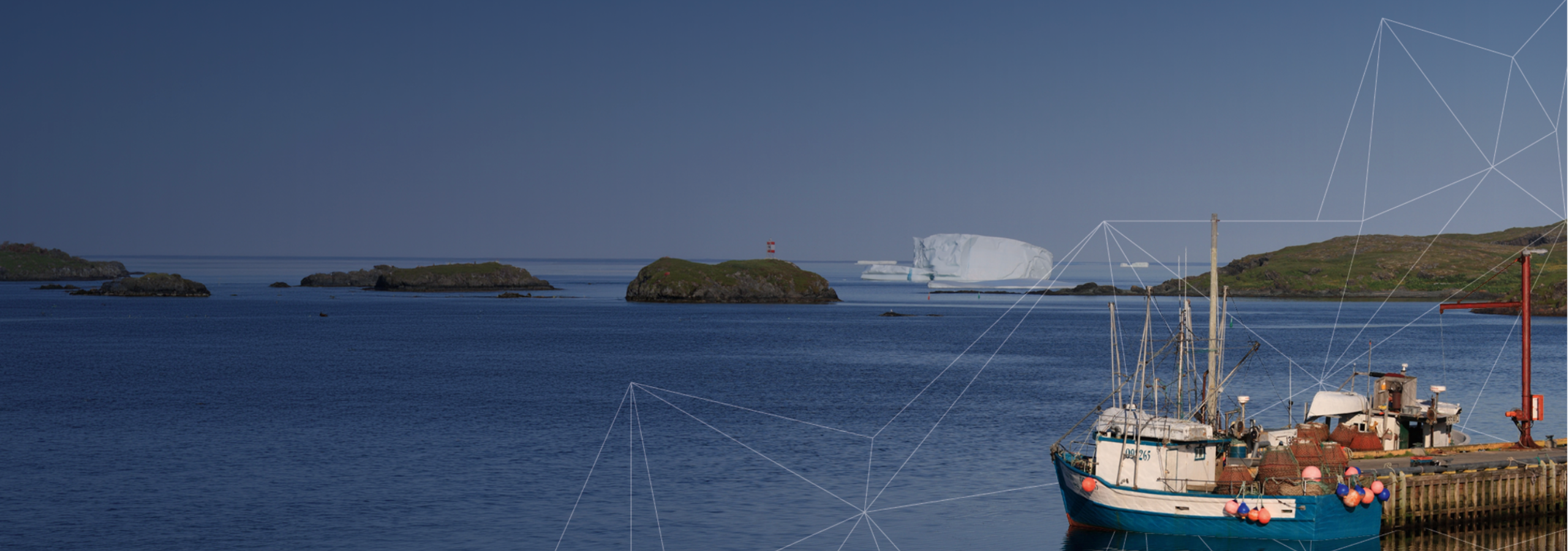 Harbor view with iceberg near Newfoundland, Canada
